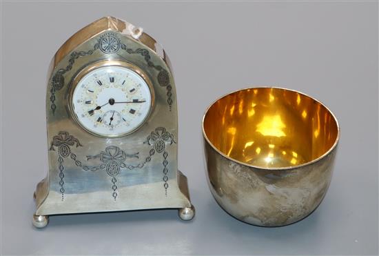 A George V silver mounted miniature lancet timepiece and a modern silver beaker.